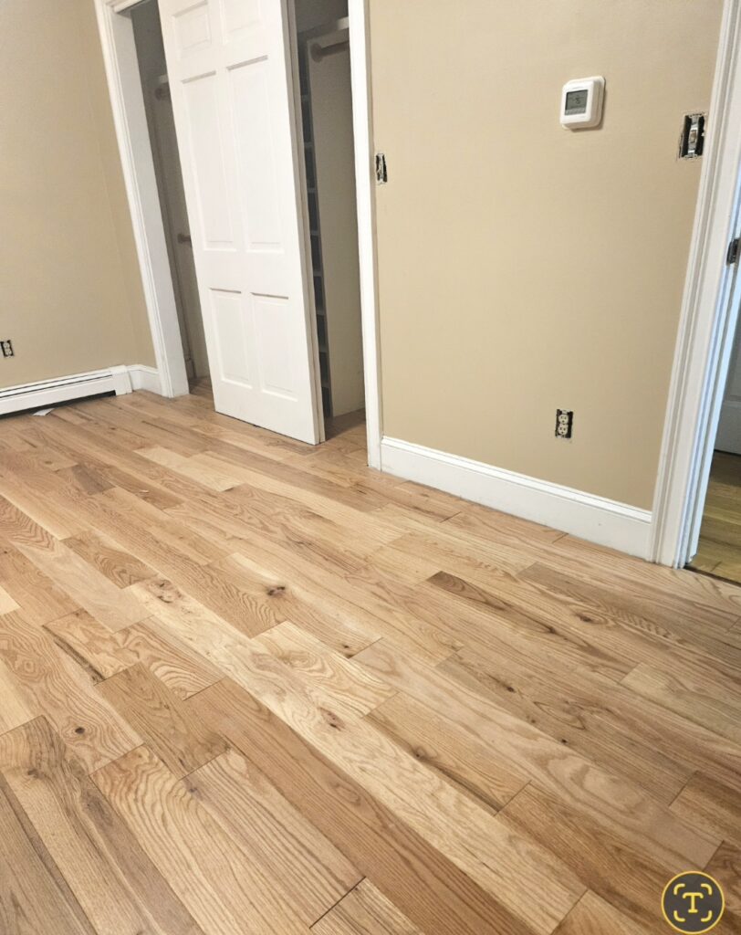 New Hardwood floor installation in a remodeled home by Pillco Construction Corp